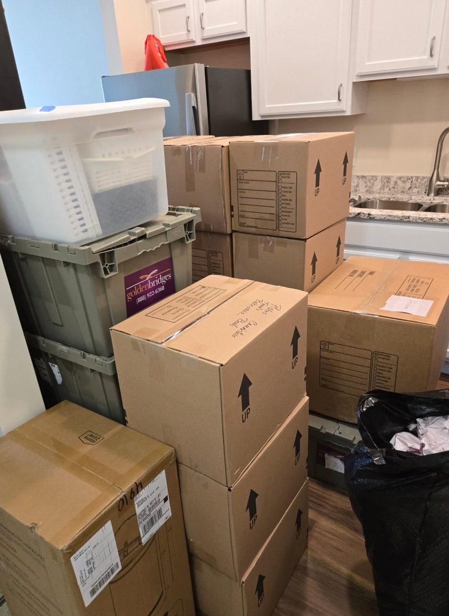 A kitchen stacked with moving boxes before a Golden Bridges move