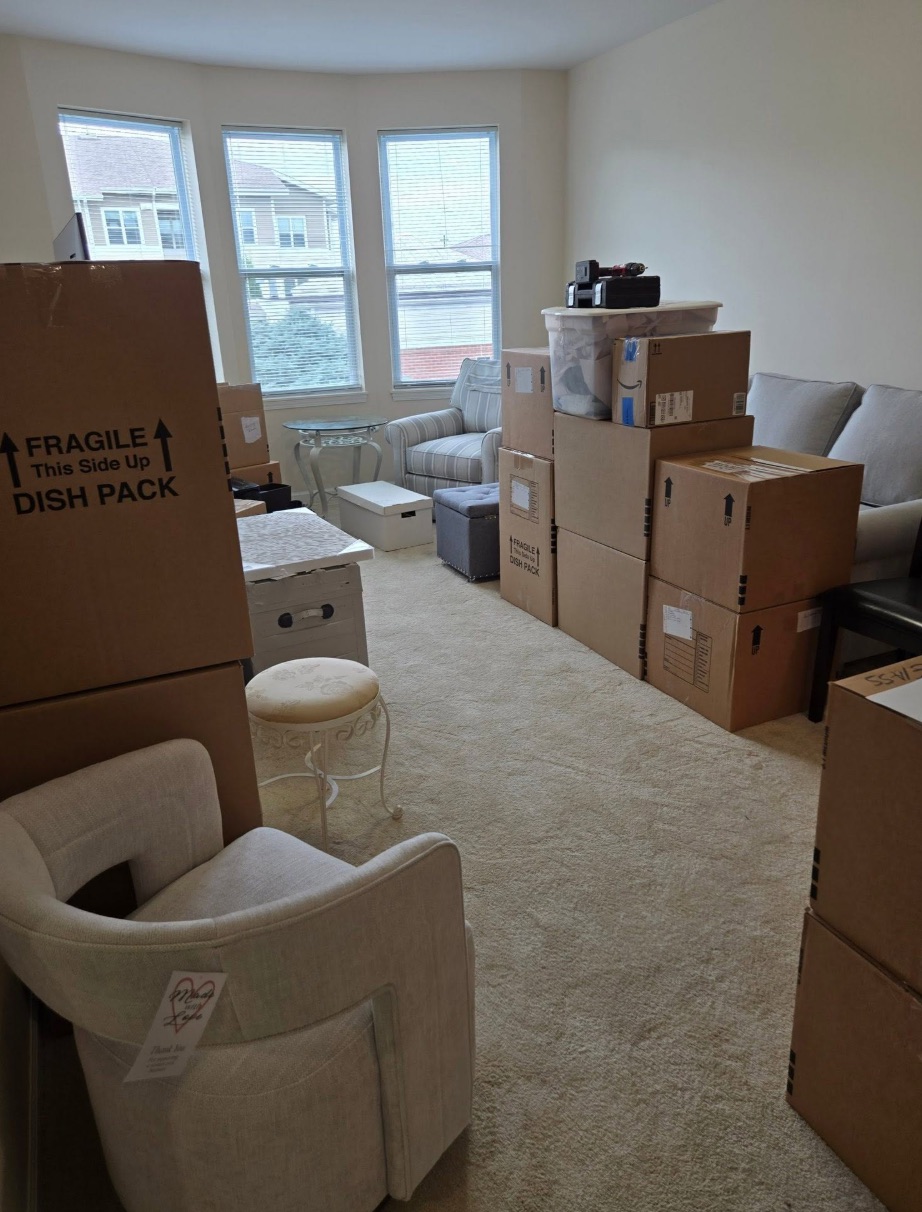 A living room full of moving boxes before a Golden Bridges move